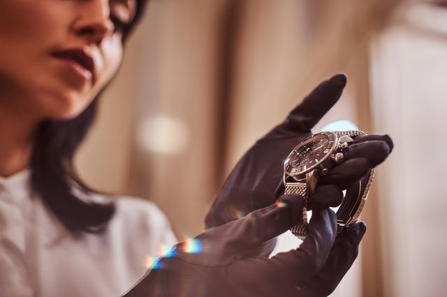 Specialist inspecting a luxury watch